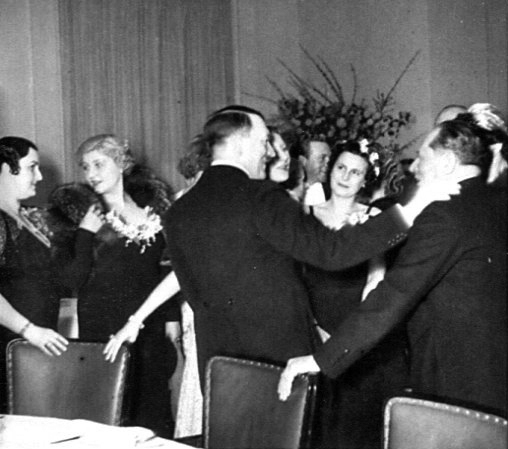Adolf Hitler greets Heinrich Hoffmann at a reception for artists in the Reich Chancellery